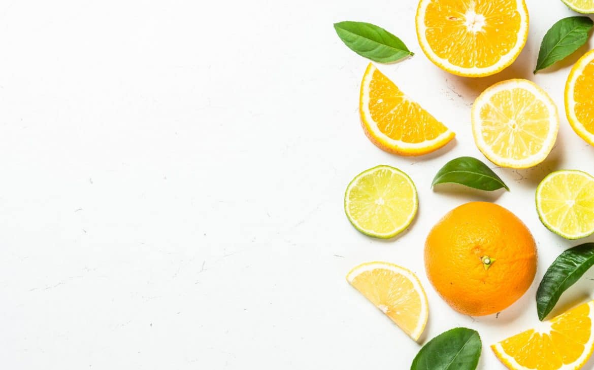 Citrus fruits at white background.